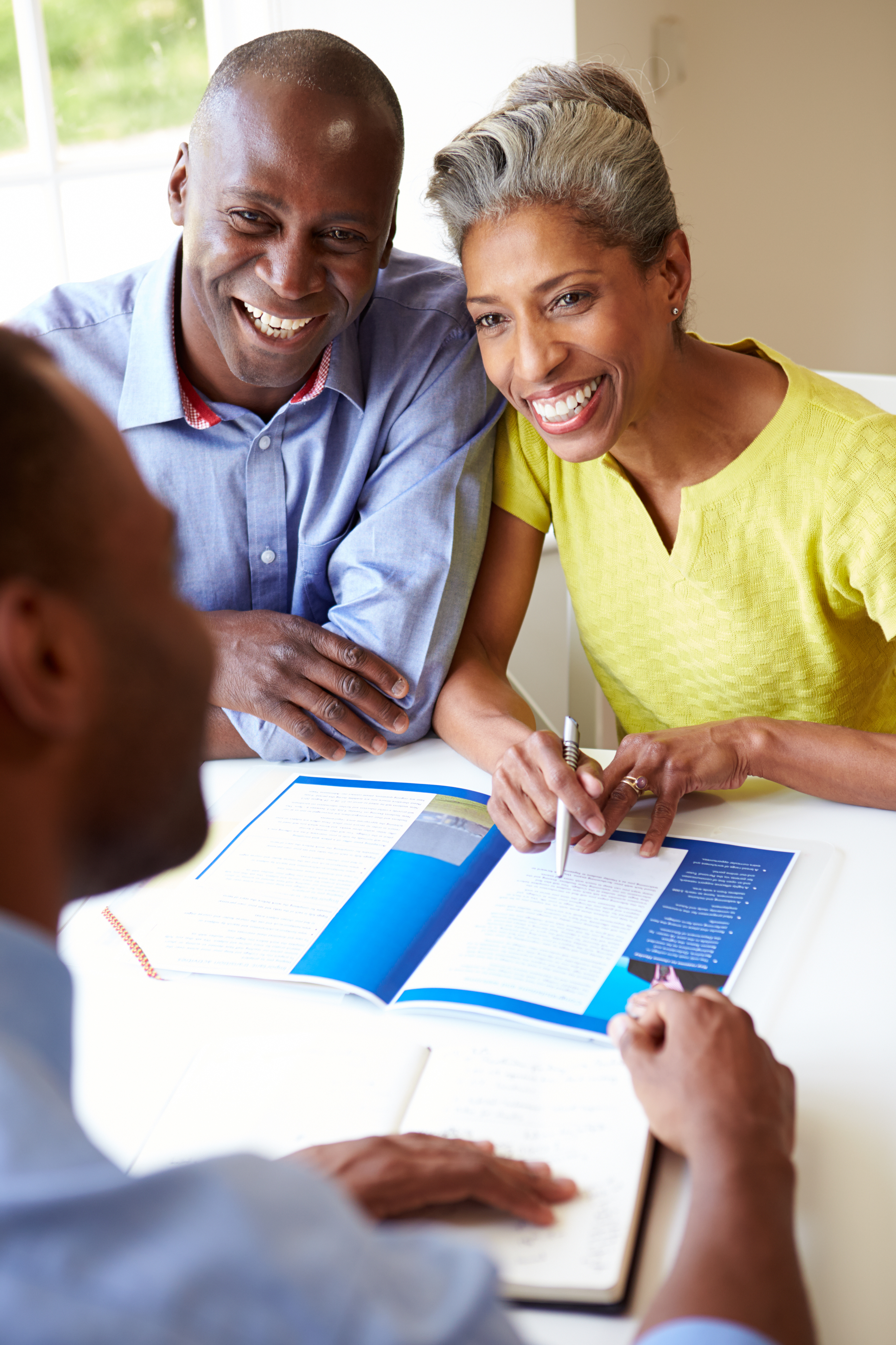 Mature couple receiving advice from a financial planner