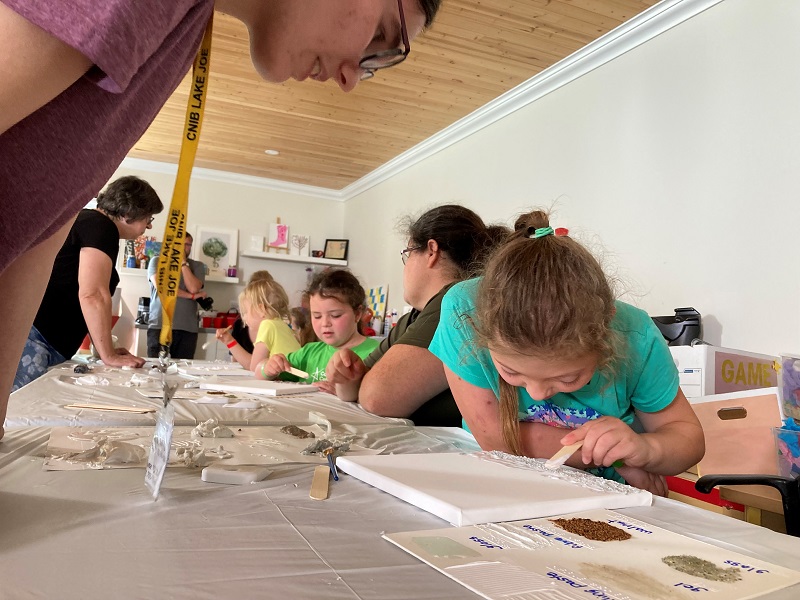 Camper in lake Joe art class