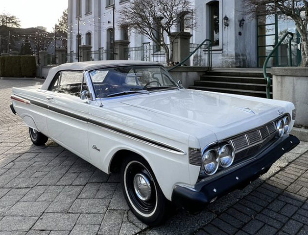 A white 1964 Mercury Comet Caliente Convertible.