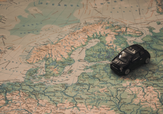 Map with a tiny car on it.
