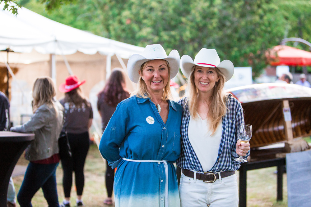 Michaela Hutchison (left) & Nancy Simonot (right)  wearing cowboy hats at the CNIB Lake Joe Taste of Country event.