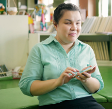 Woman using a smart phone in an office