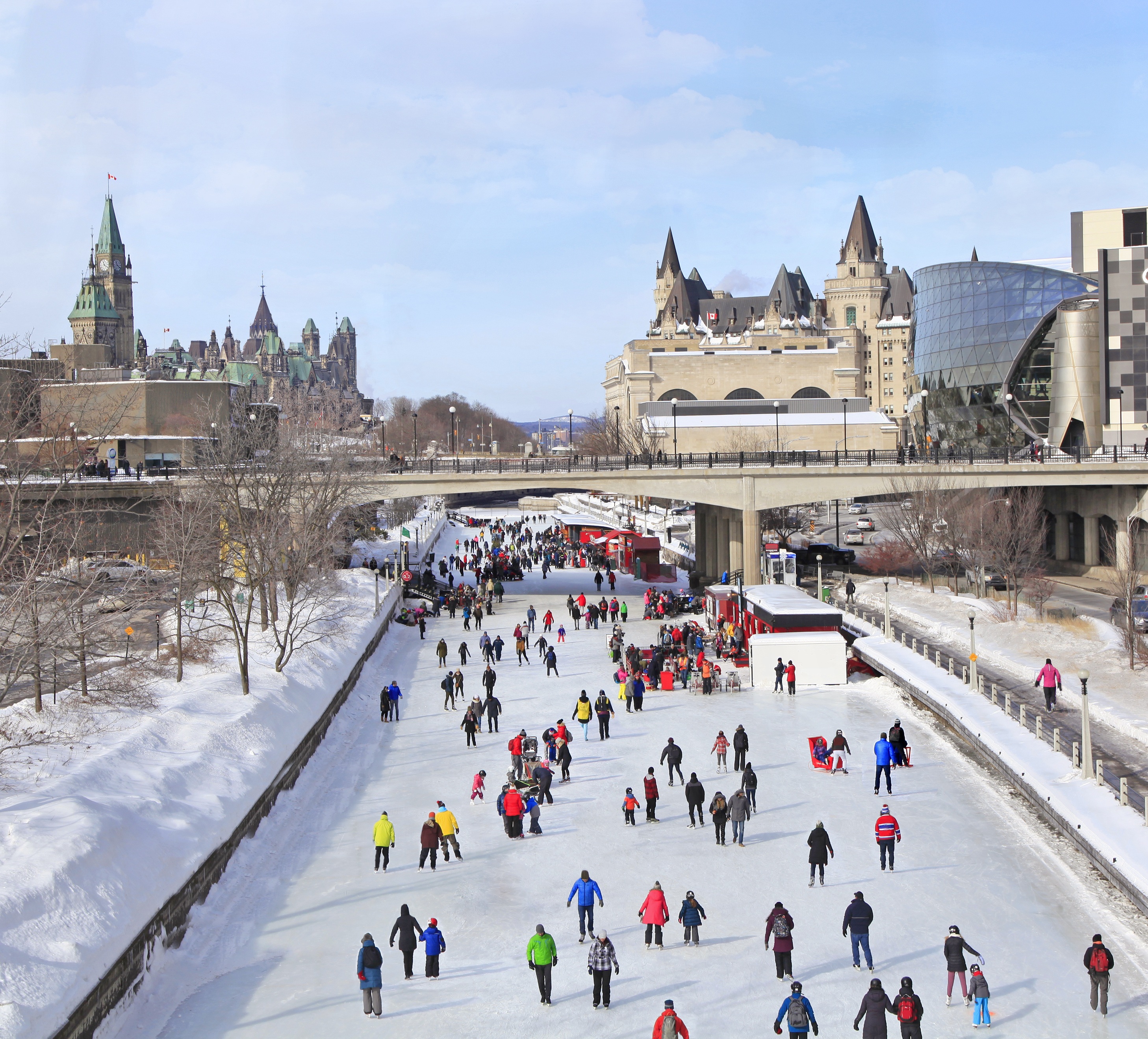 A crowd of people skating the length of the Rideau Canal.
