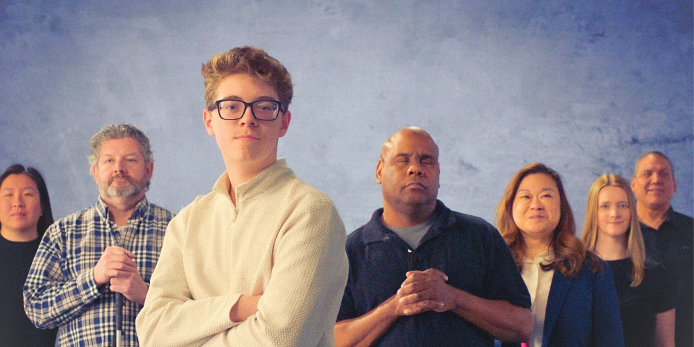 The group of participants from the Watch me Campaign, all standing together looking into the camera