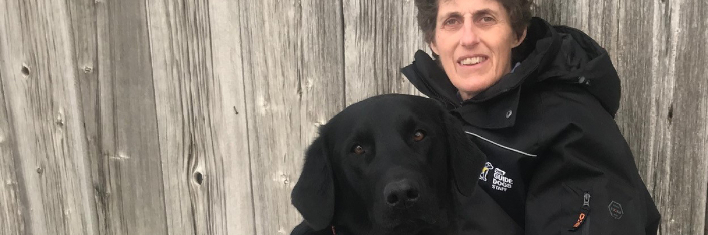 Dr. Bennett and a black dog.