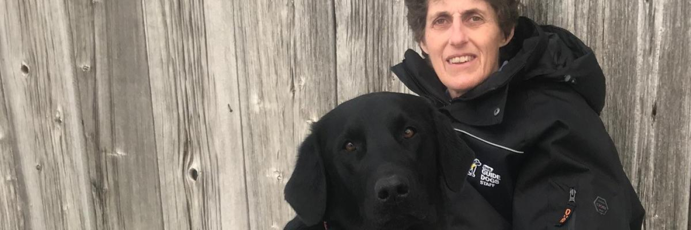 Dr. Bennett and a black dog.