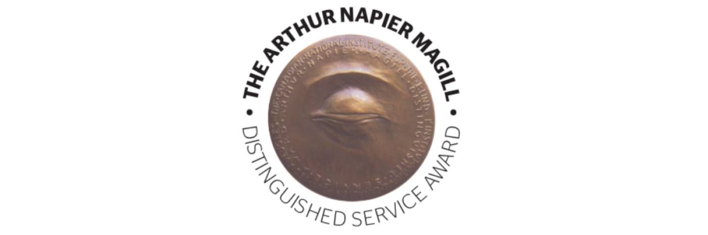 The Arthur Napier Magill Distinguished Service Award. A tactile bronze medallion with a sculpted design of a closed eye.