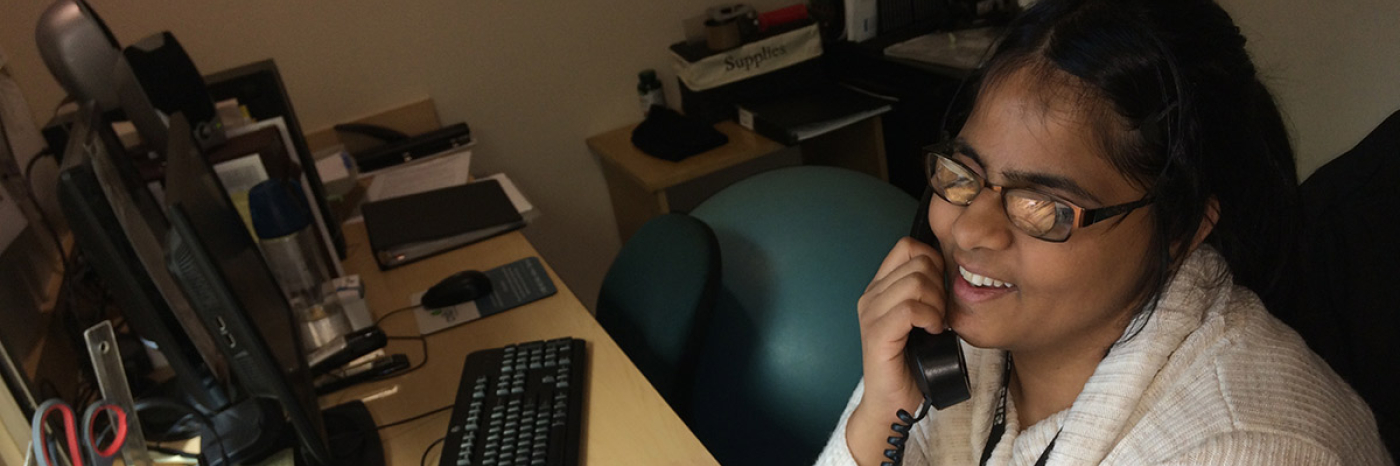 Shruti helping a caller at reception