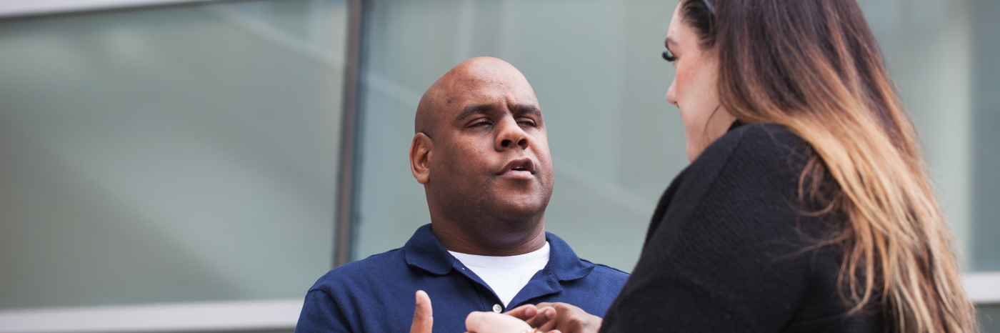 An intervenor uses print on palm to communicate with Floyd.