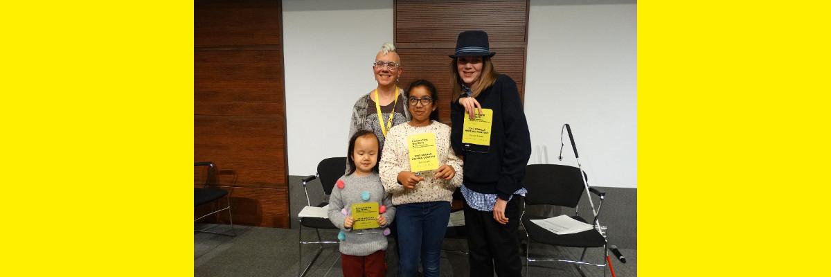 Winners from the 2019 Braille Creative Writing Contest Kelsey, Zara and Zachary pose for a photo with Karen Brophey. They are holding their awards!