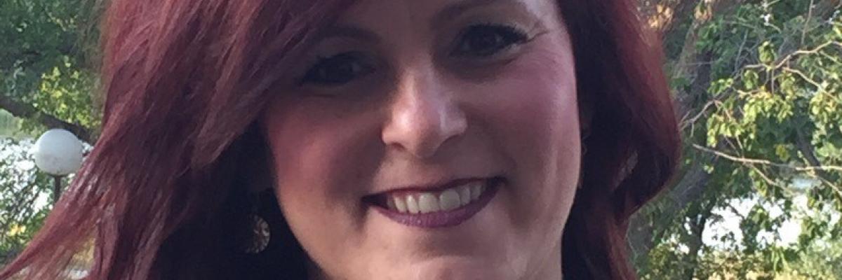 Manager Brenda Heisler smiles in a head and shoulder shot.