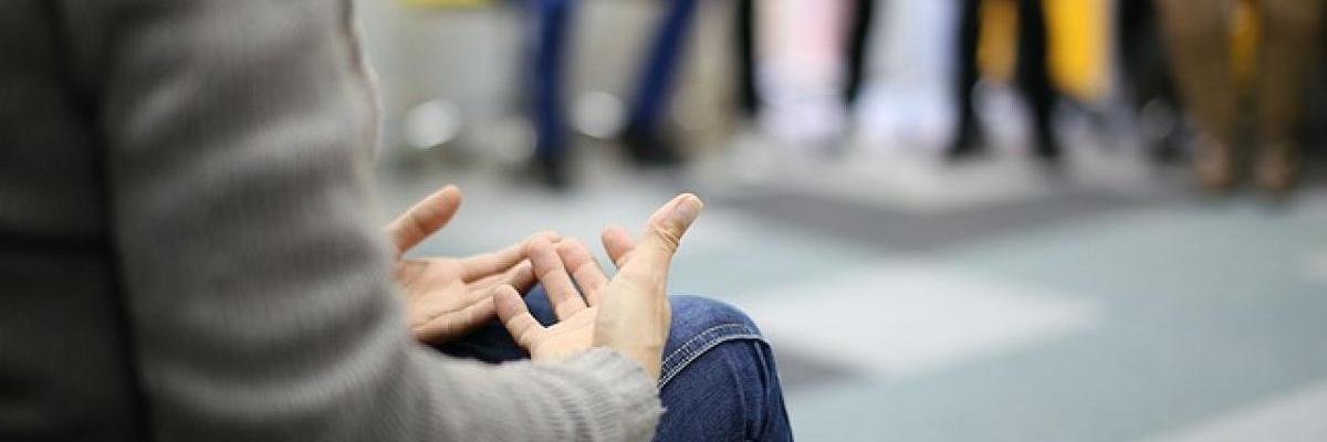 people in circle at a peer suppott group