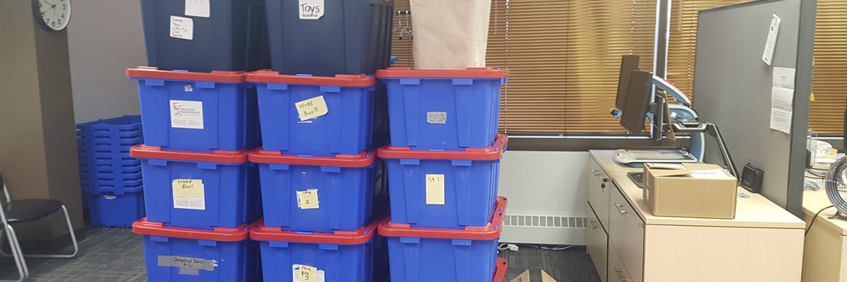 a row of boxes sit on the carpet