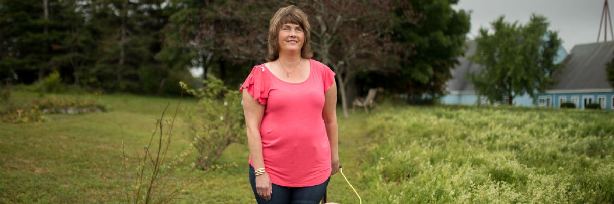 Shawny Ross standing outside smiling for the camera