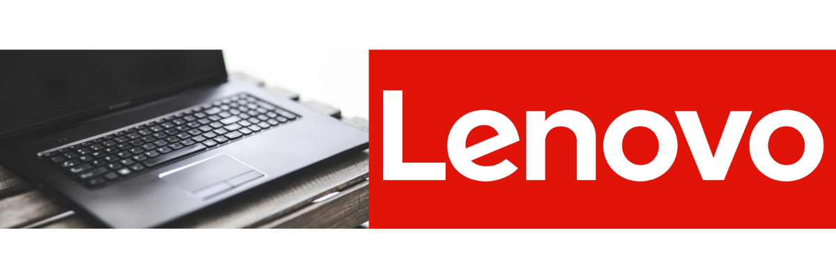 Laptop computer next to the Lenovo logo 