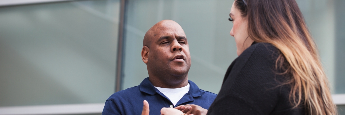 An intervenor uses print on palm to communicate with Floyd.