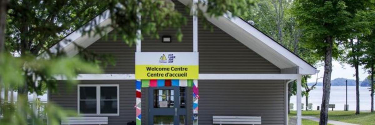 Welcome Centre entrance with colour yarn scarves wrapped around the front pillars.
