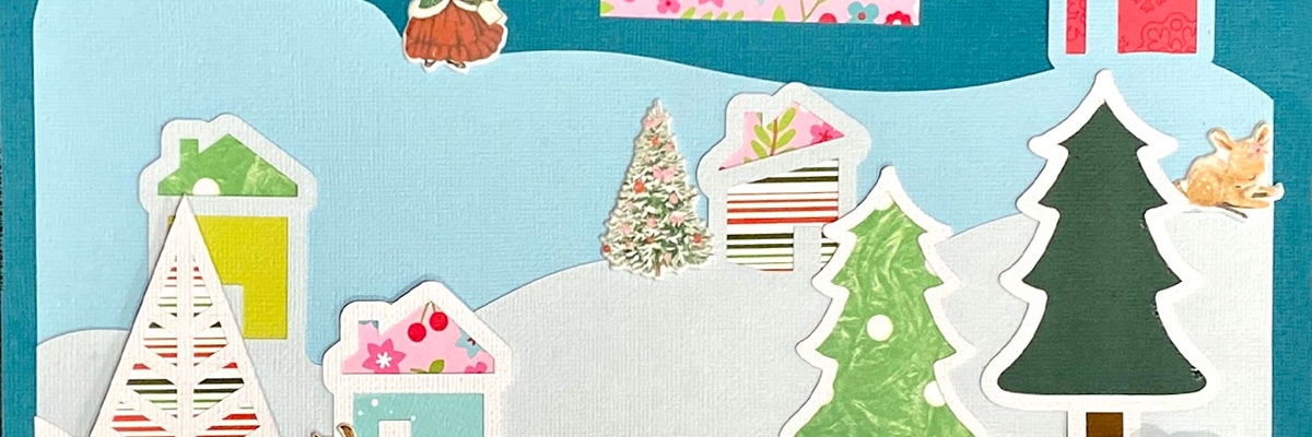 A blue page with colourful cutouts of trees, homes, snowbanks, etc.