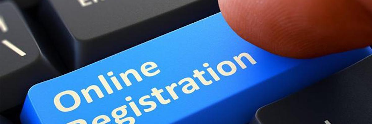 Close up of a keyboard featuring a blue "Online Registration" button