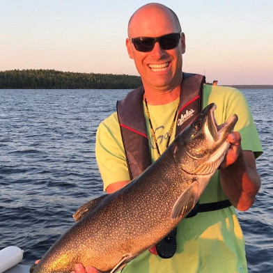 Barry Quick holds a giant fish he caught.