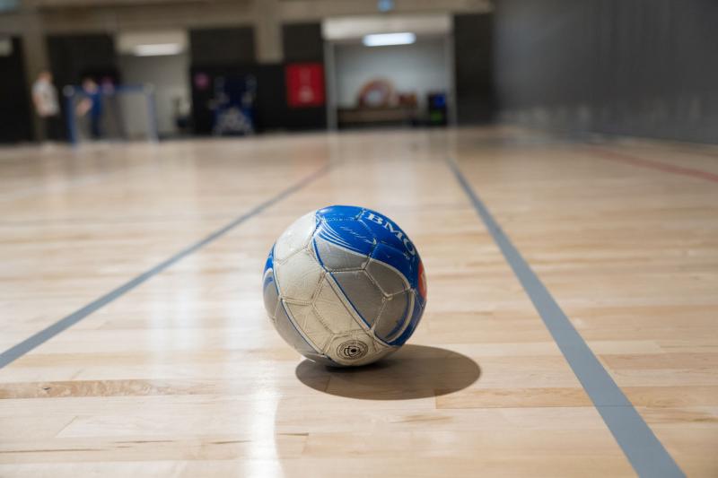 An adaptive soccer ball on an indoor court.