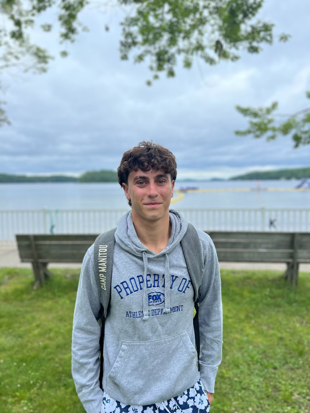 Zachary Levin smiles as he stands in front of the Lake Joe waterfront.