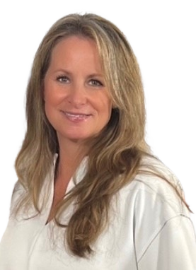​Headshot of Susie with long blonde hair, wearing a white blouse.