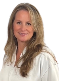 A professional headshot of Susie smiling at the camera.