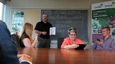 A group of people participating in tech training