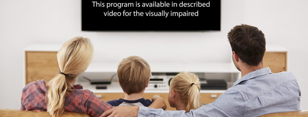 A family of four sit on the couch watching a television. Displayed on the tv screen is the text: This program is available in described video for the visually impaired.