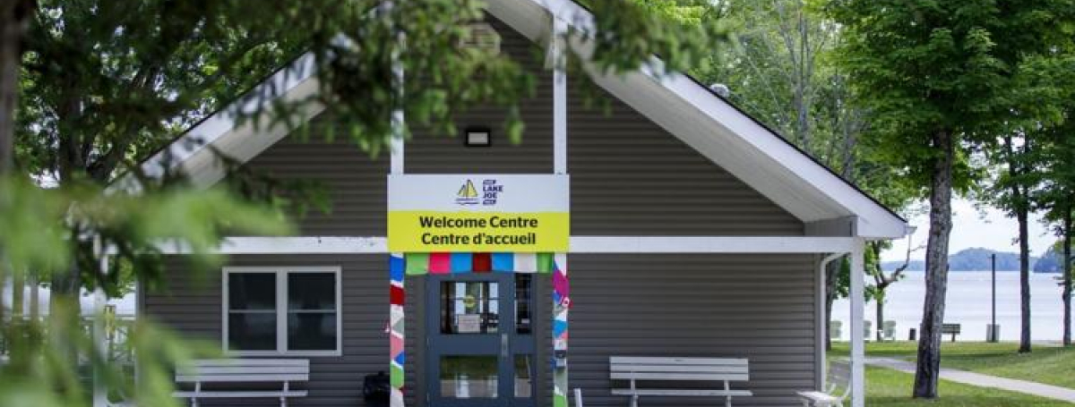 Welcome Centre entrance with colour yarn scarves wrapped around the front pillars.