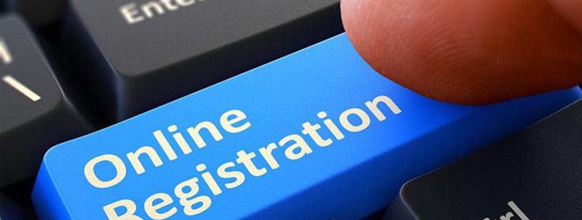 Close up of a keyboard featuring a blue "Online Registration" button
