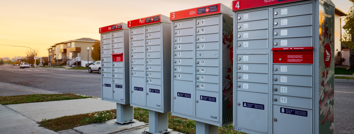 Four Canada Post community mailboxes in a residential neighbourhood