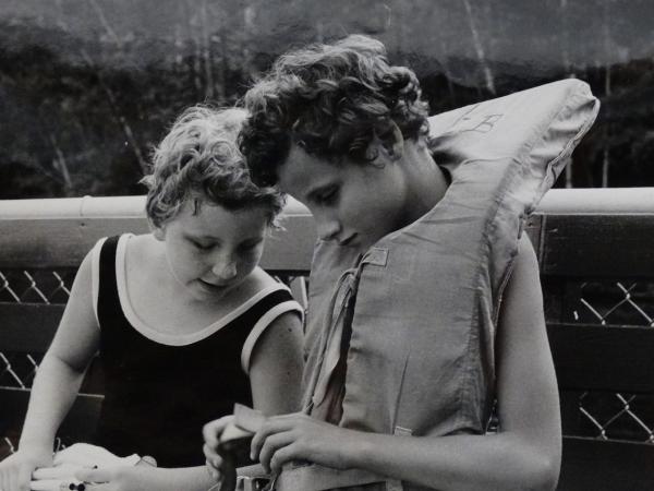 two children, life jacket at dock