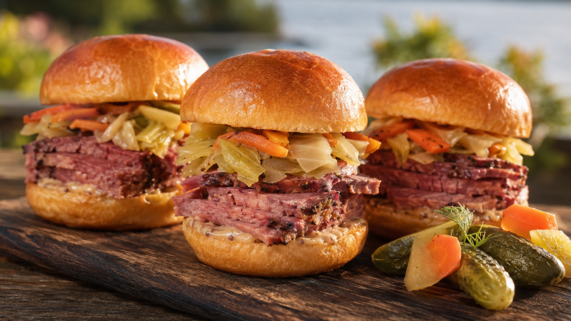 Delicious looking sliders against a lake background