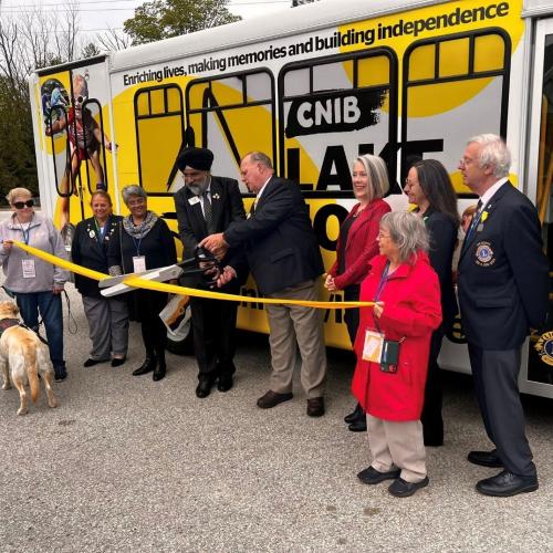A ceremonial ribbon is cut by A.P. Singh, First Vice President of Lions International, and PCC Robert (Bob) Tanner, Chair, Sight Conservation and Co-Chair, MDA Lions/CNIB Committee at the MDA Lions Convention, May 24, 2025