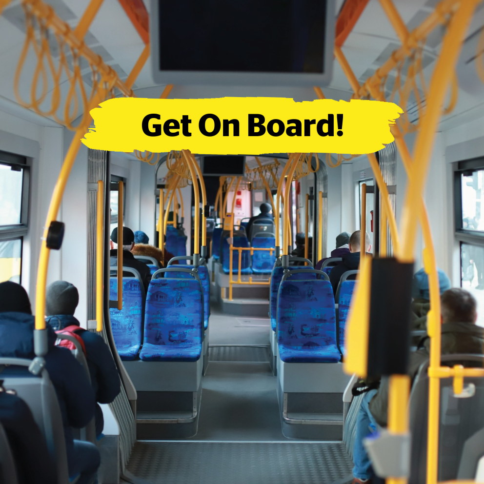 The interior of a city bus with passengers seated. The image is taken from the back of the bus. In the centre of the image is a brushstroke overlay with the text: Get on Board!