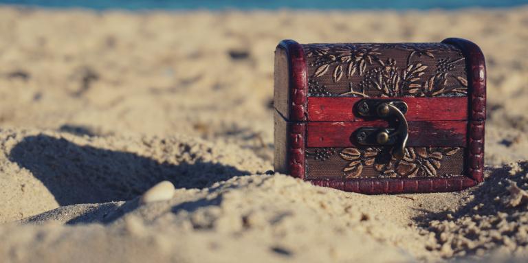 A treasure chest sits on a beach