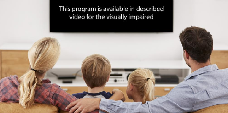 A family of four sit on the couch watching a television. Displayed on the tv screen is the text: This program is available in described video for the visually impaired.