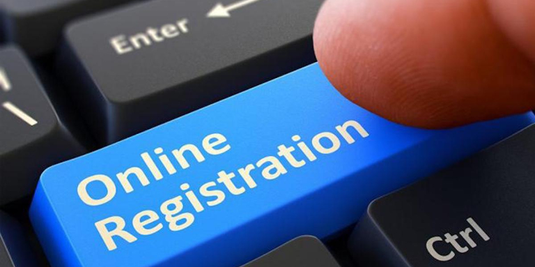 Close up of a keyboard featuring a blue "Online Registration" button