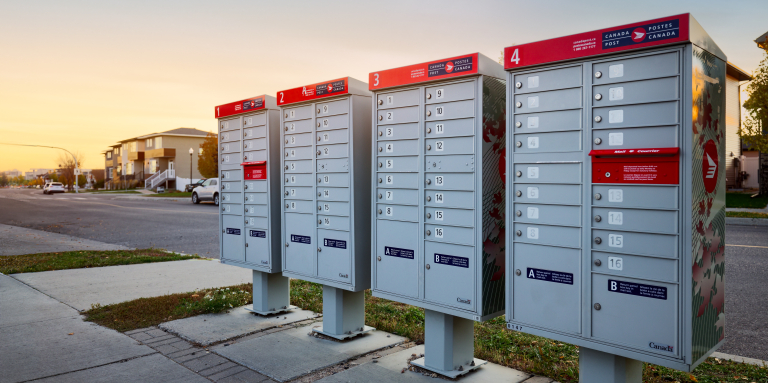 Four Canada Post community mailboxes in a residential neighbourhood