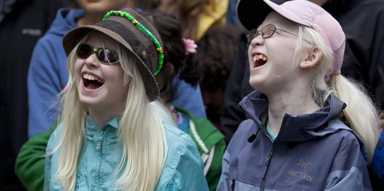 Two girls who are blind laughing together