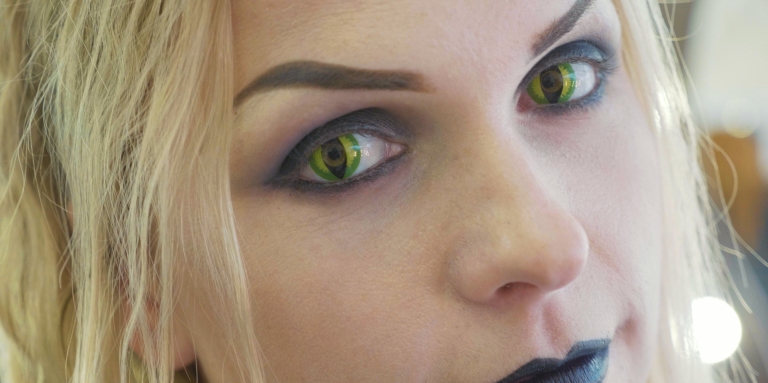 Image of woman wearing cat eye contact lenses