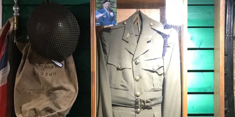 Caption: Alfred Pretty’s special forces uniform, hat and backpack are on display in the museum at Dildo Brewing Co. in Dildo, NL. 