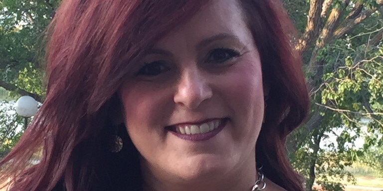 Manager Brenda Heisler smiles in a head and shoulder shot.