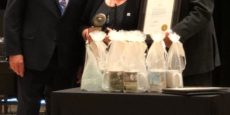 John Magill and John Rafferty standing with Louise Gillis, recipient of the Arthur Napier Magill Distinguished Service Award