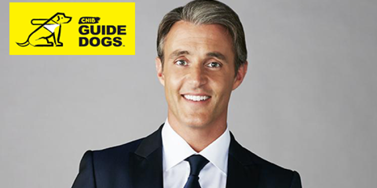 Ben with the Guide Dog logo