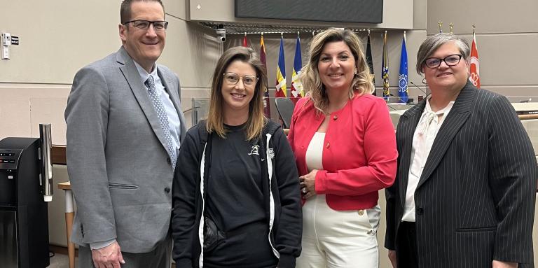 Craig Peterson, Executive Director, Alberta and Northwest Territories, CNIB; Kezia Gray, Trainer, Puppy Development, CNIB Guide Dogs with a puppy in training; Angela Bonfanti, Chief Operating Officer, CNIB and Christall Beaudry, Vice President, Western Canada, CNIB at the City of Calgary Public Hearing Meeting of Council on Tuesday, April 9, 2024.